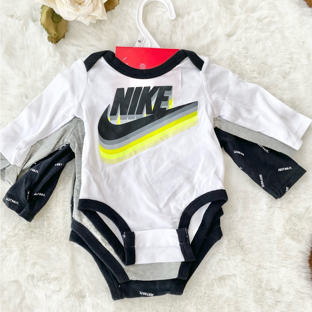 NWT NIKE 3PK LOGO BODYSUITS (onesies) with logo & “JUST DO IT” Blk, grey, white